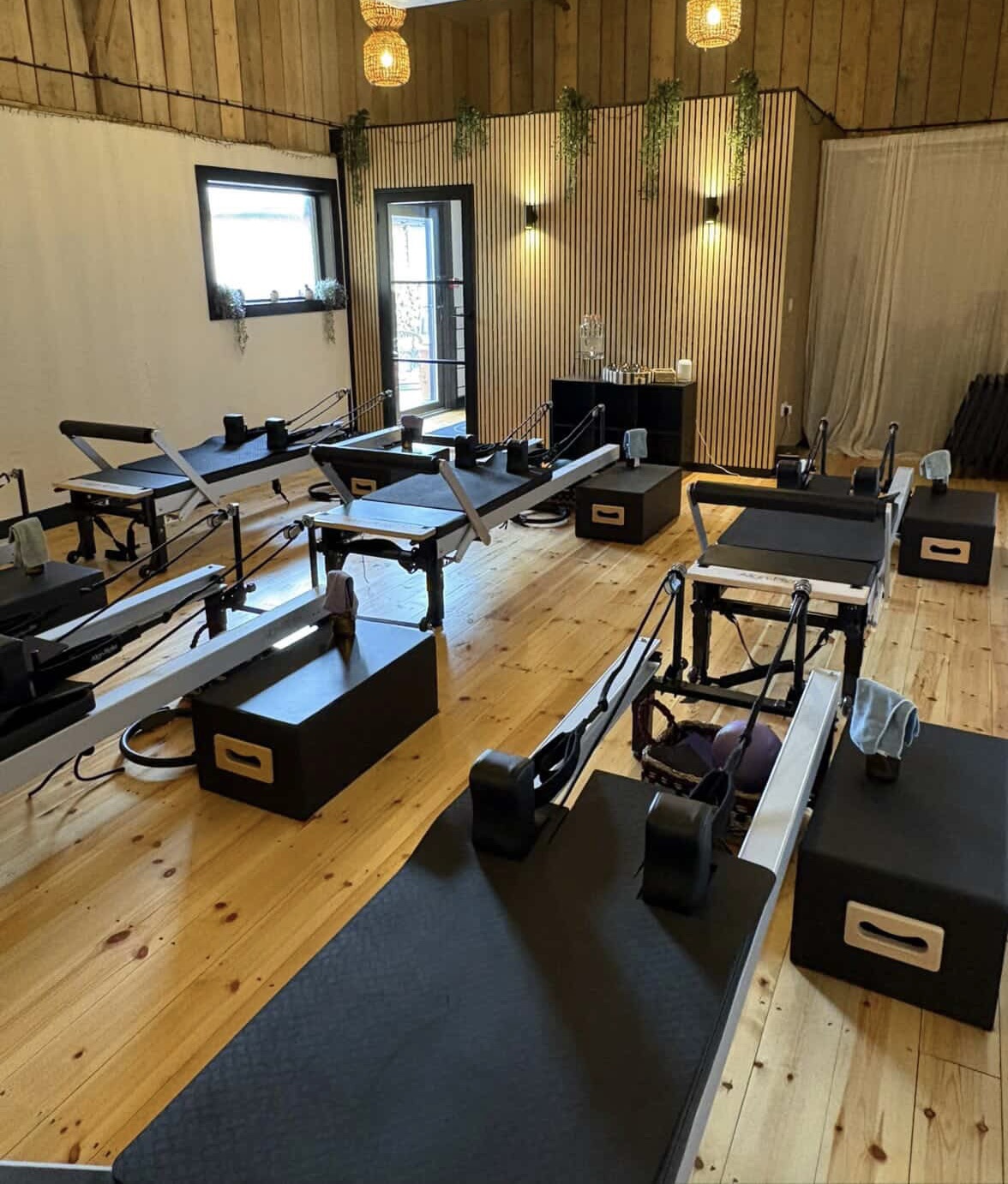 Reformer beds inside the AnyBody Clinic studio